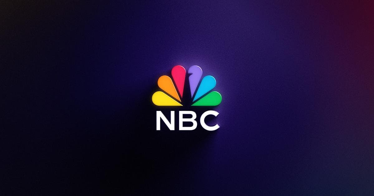 NBC logo in white lettering with rainbow peacock dark purple background